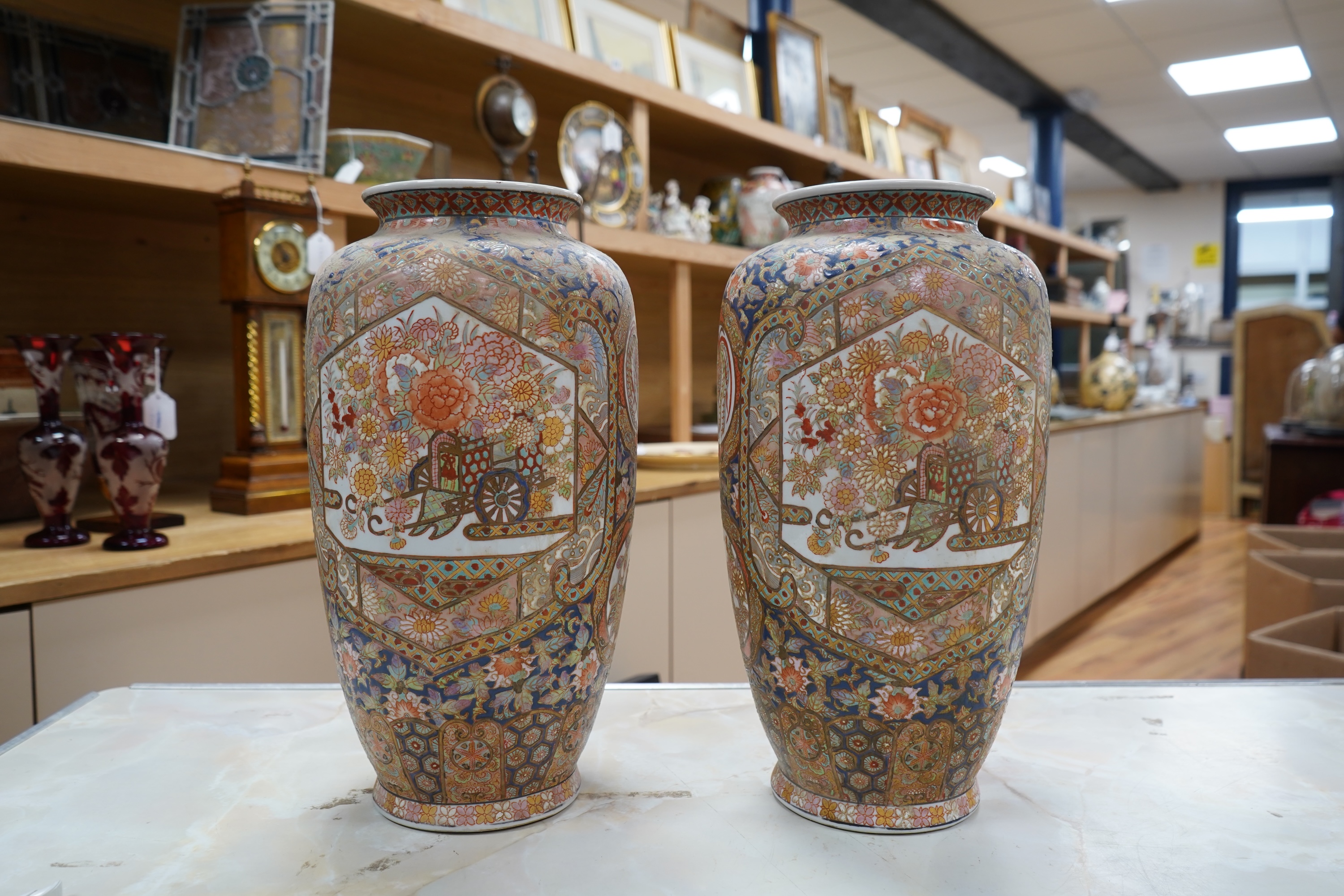 A pair of early 20th century Japanese satsuma pottery vases, 37cm high